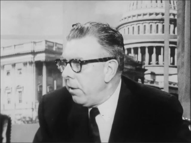 1960s: Congressman Willis speaking behind a desk, stumbling through speech slightly.