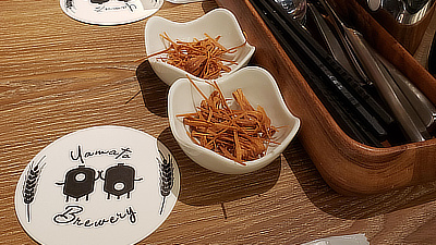 Crisped udon noodles on a table at the Yamato Brewery.