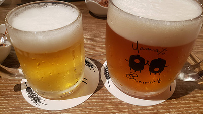 Drinks in glass mugs at the Yamato Brewery in Nara, Japan.