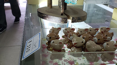 Deer figurines on top of a display case.