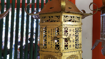 A metal lantern with delicate etchings.