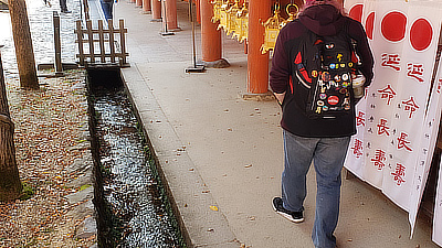 John walks along one of the shrine's inner walls