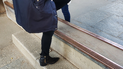 A woman steps over one of the entryways to Todaiji.