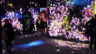 People walk through the "Forest of Flowers and People".