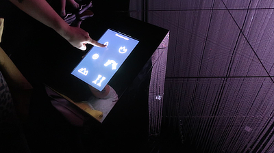 A kiosk allowing visitors to add or trigger certain light and sound effects in the "Wander through the Crystal World" exhibit.