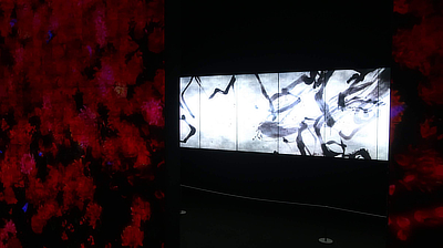 A stark black and white display inside one of the rooms within the "Forest of Flowers and People" exhibit.