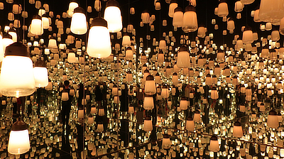 People move through the "Forest of Lamps" exhibit.