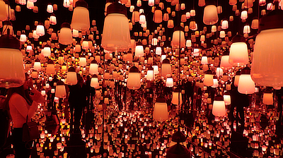 Lights begin to shift in the "Forest of Lamps" exhibit.