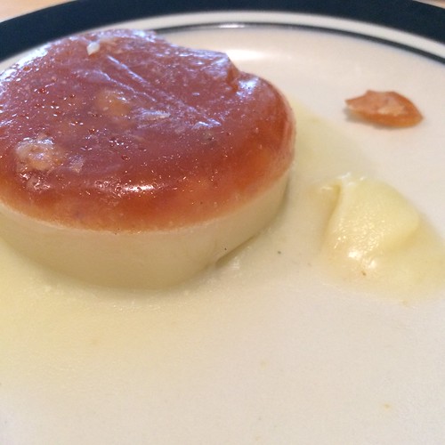 A two layer round disk. The top layer is a medium brown and is non-fat chicken drippings. The bottom layer is pale ivory and is rendered chicken fat.
