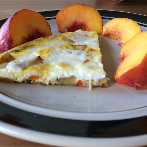 A quarter of an almost Spanish tortilla, surrounded by peach slices. Because it is still peach season, yay!!!