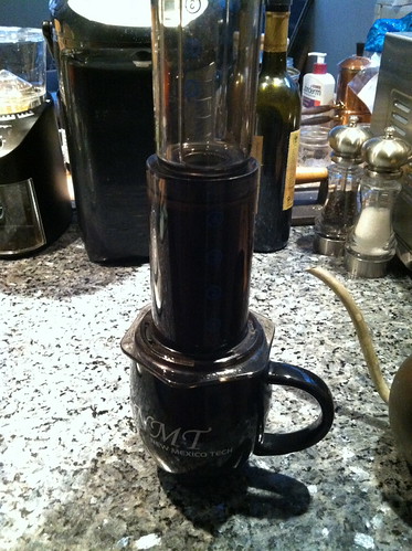 AeroPress coffee maker on top of mug.